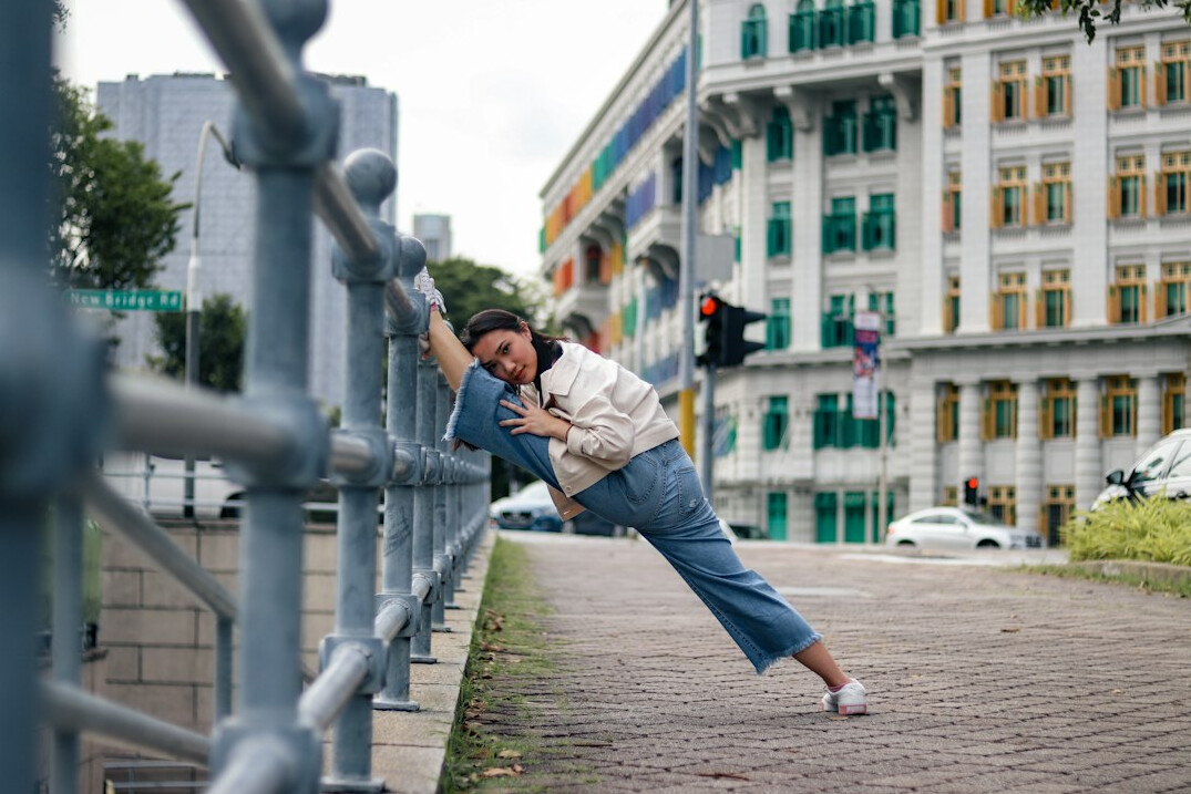 Professional headshot of a Singaporean Chinese female health coach instructor