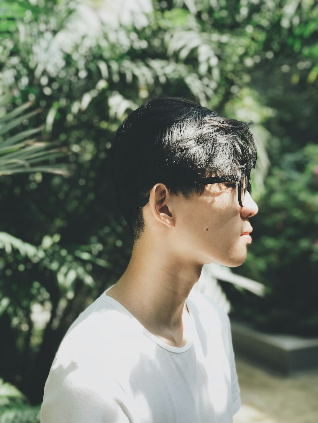 Professional headshot of a Singaporean Chinese male mental wellness instructor