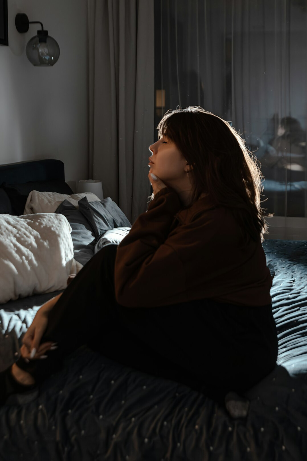 woman meditating in peaceful room
